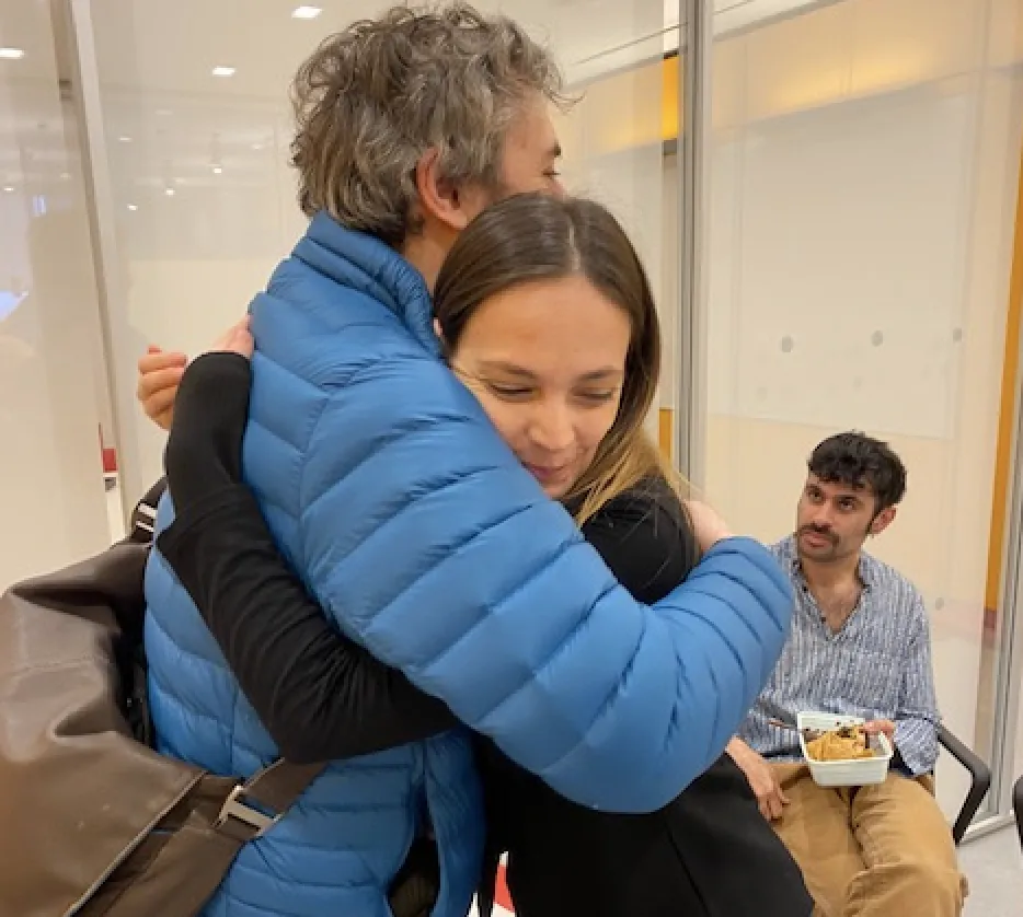 Kevin and Albana hug. 
