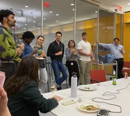 a group gathers to hear a toast