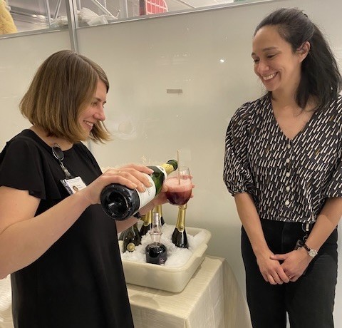 Two friends mixing a drink