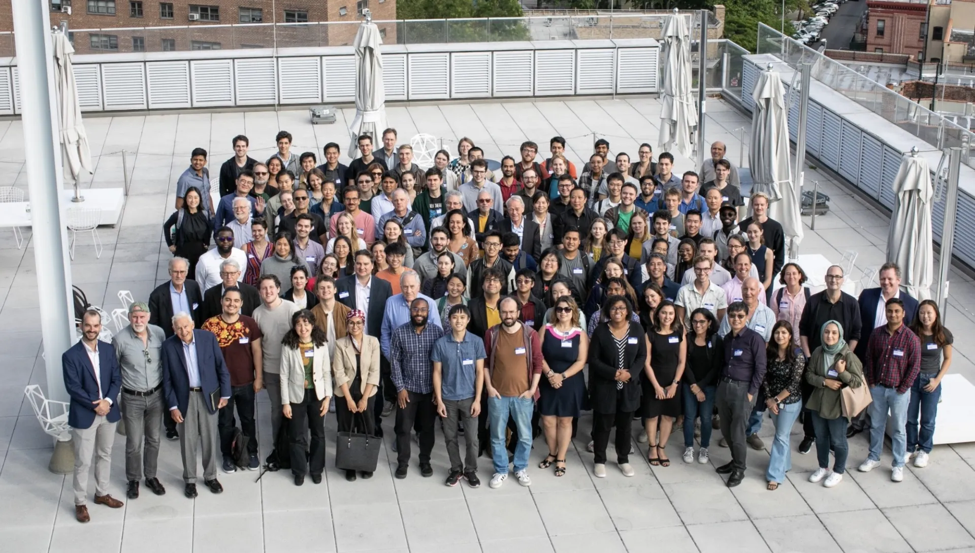 large group of people standing outdoors together