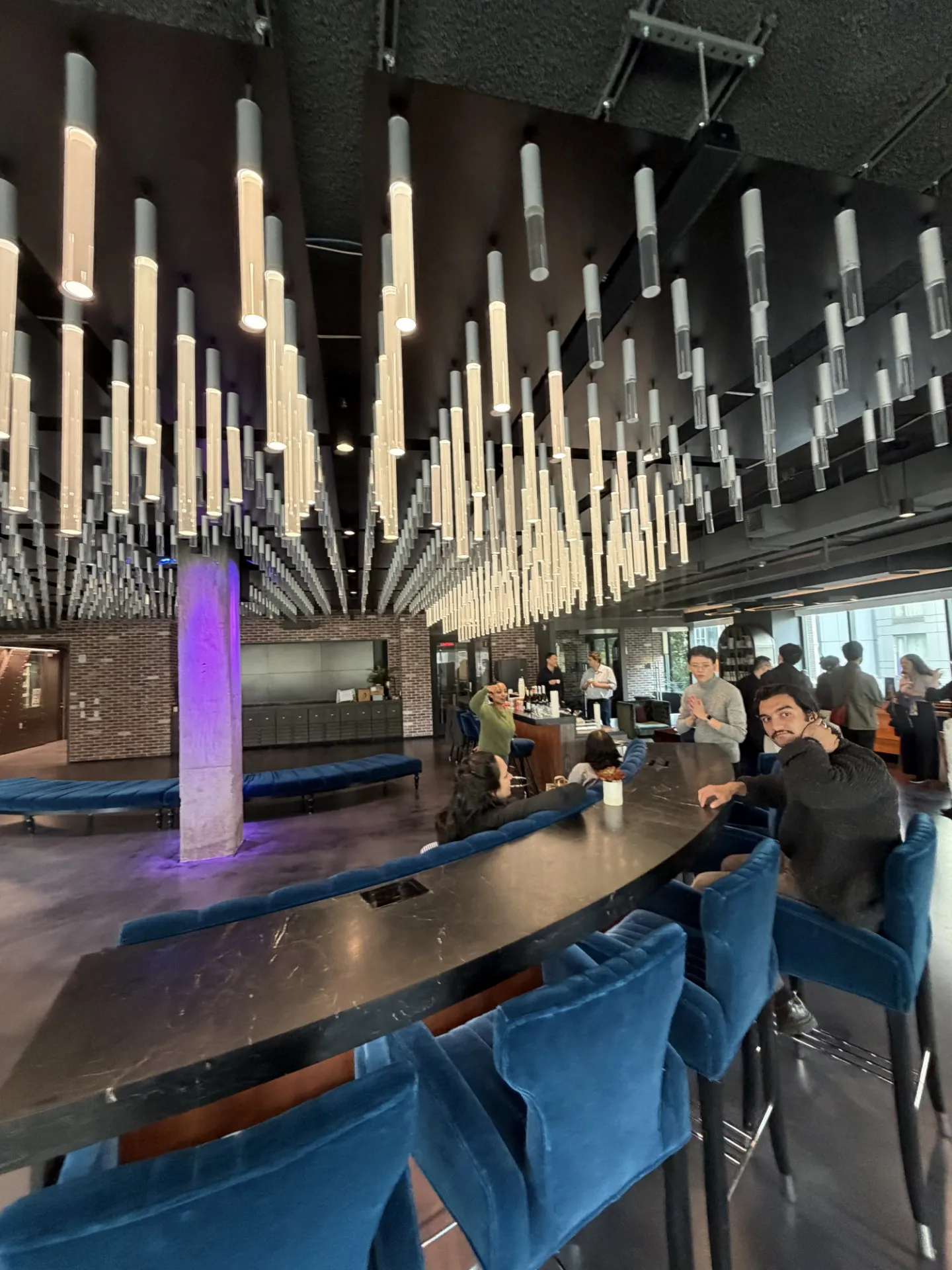 group of people mingling in a lounge setting 