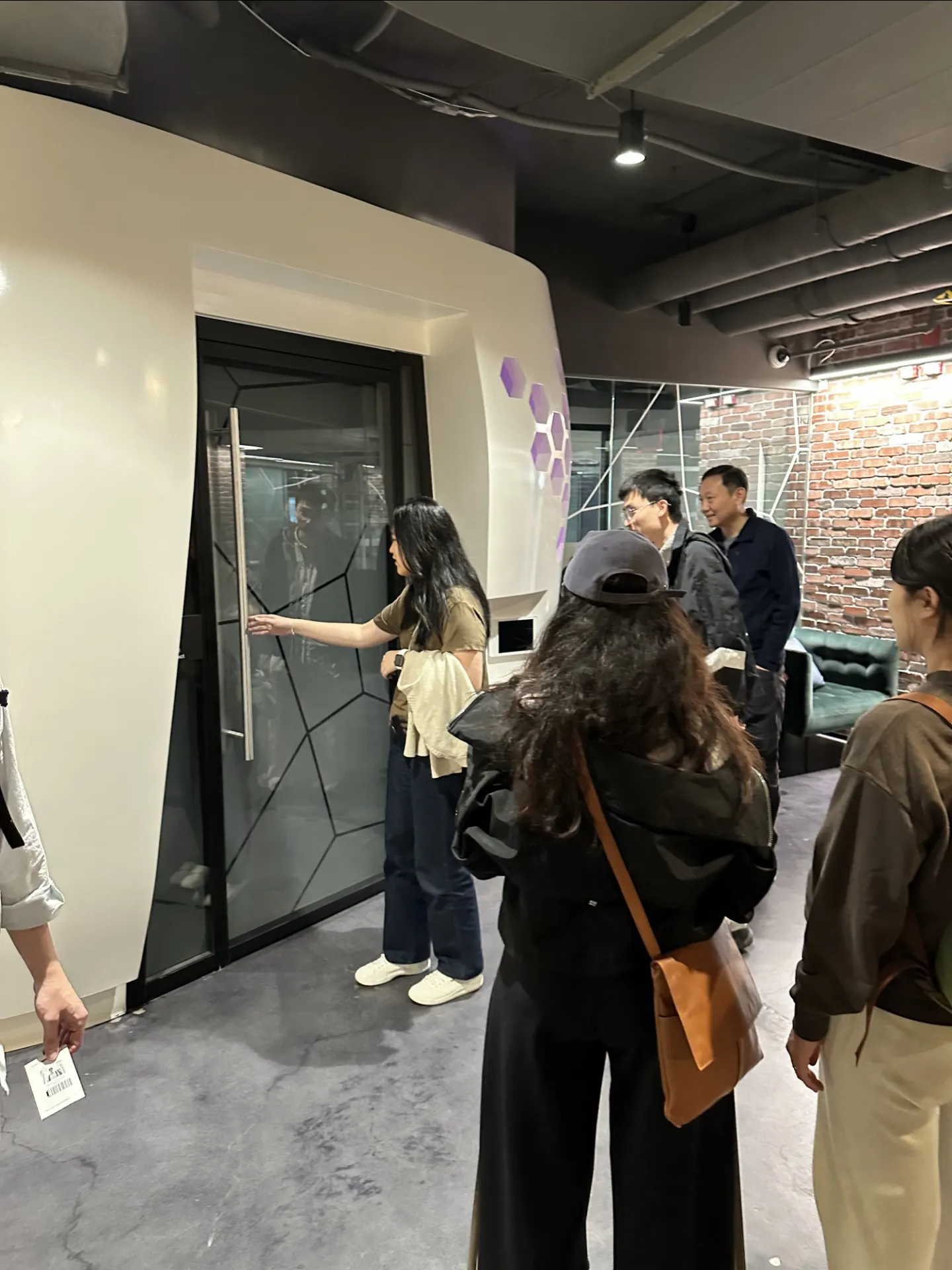 group of people opening a modern door 