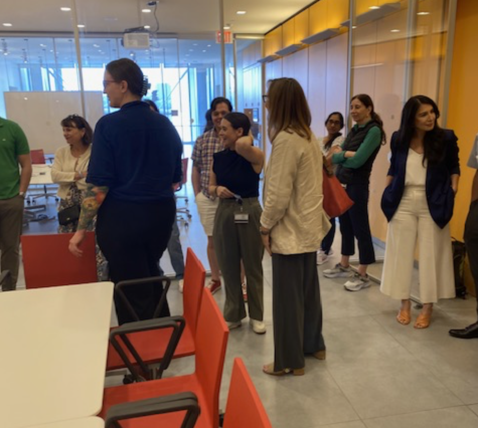 group mingling in the conference room