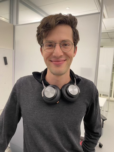 A portrait of a graduate student smiling.